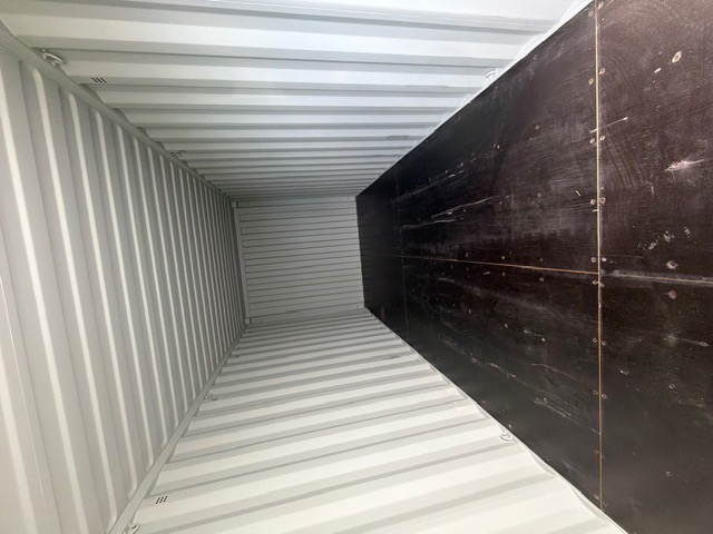 Inside a shipping container looking toward the doors